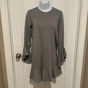 Gorgeous gray dress with bell detail on sleeves and ruffle hem. Size S.